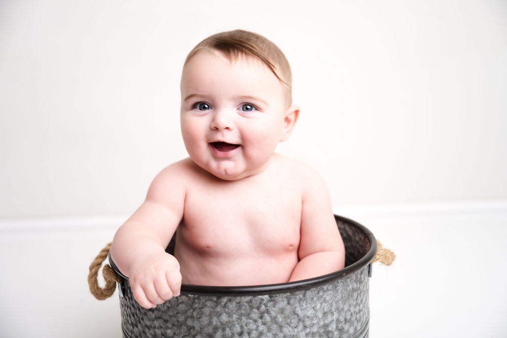 six-month-baby-in-studio-session-water-bucket